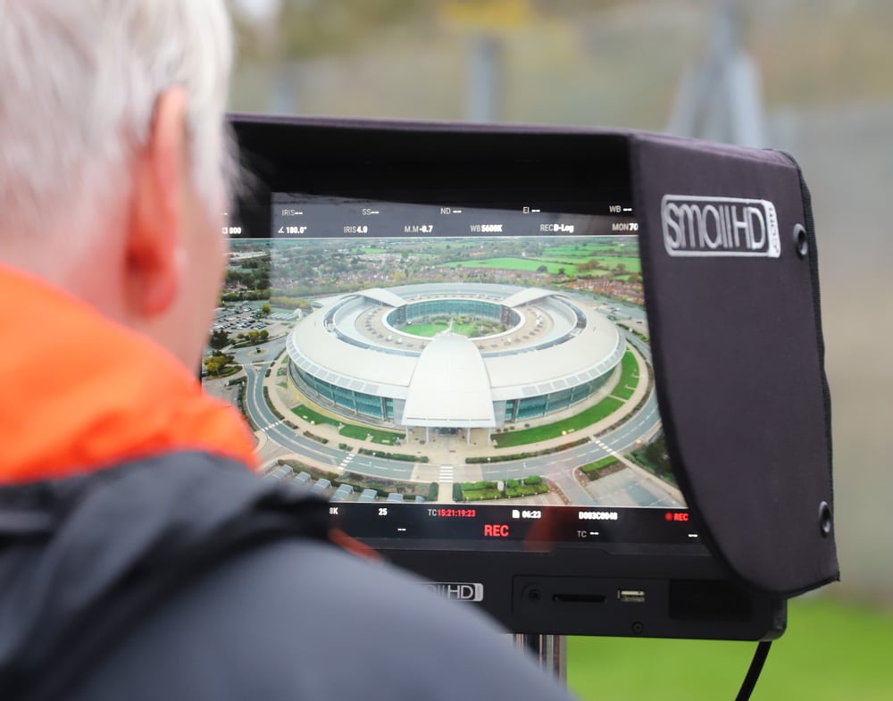 A camera operator overlooks a view of a shot about the Doughnut