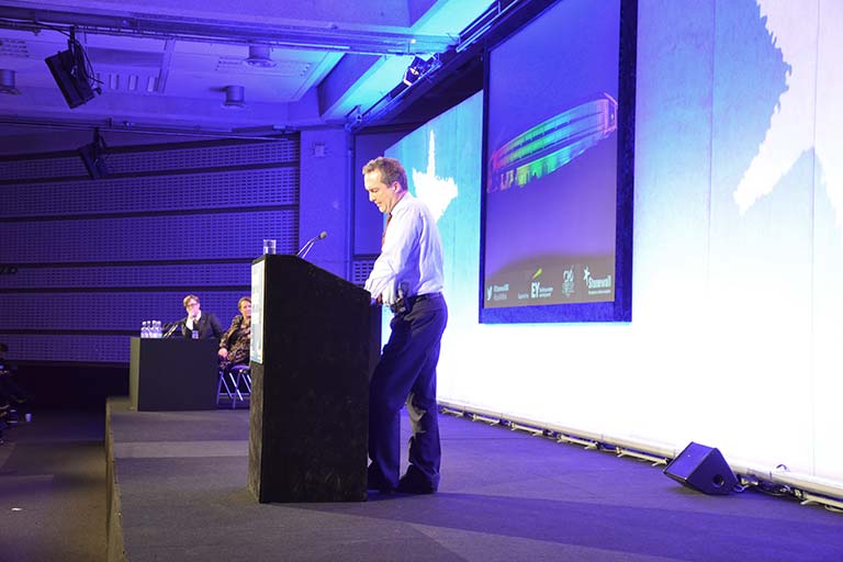 GCHQ Director Robert Hannigan stood at plinth