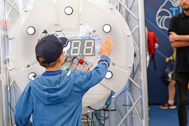 The student is pressing buttons in hopefully the correct sequence!