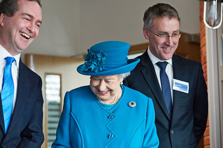 Her Majesty The Queen stood with GCHQ Director Robert Hannigan and NCSC CEO Ciaran Martin