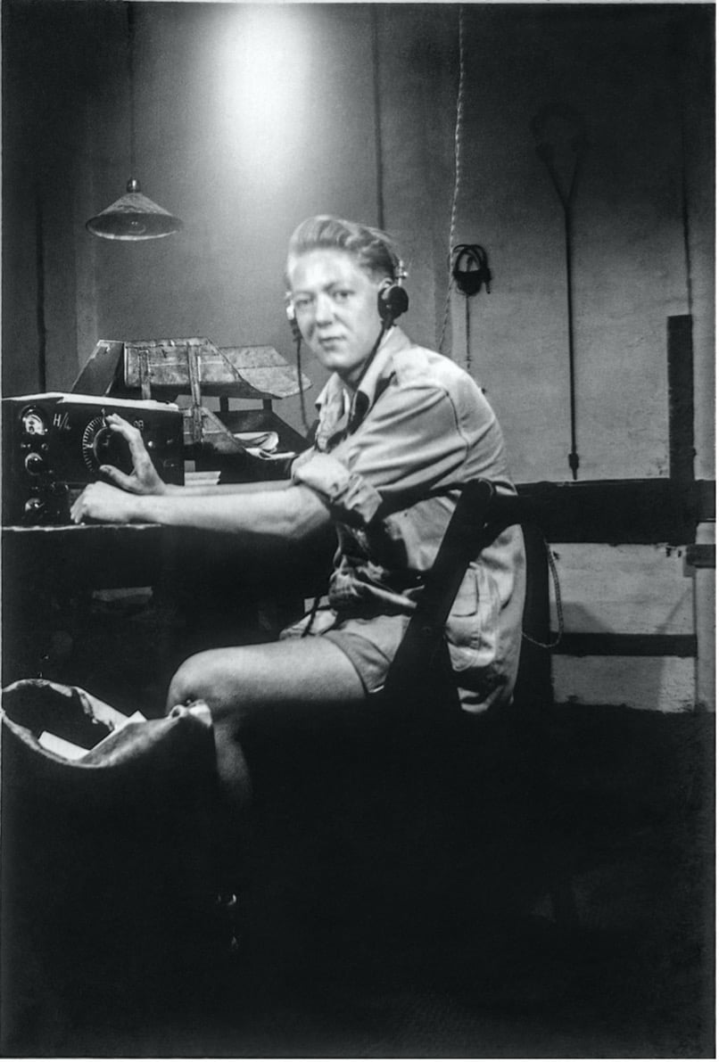 A Radio Security Service operator sat at his radio.
