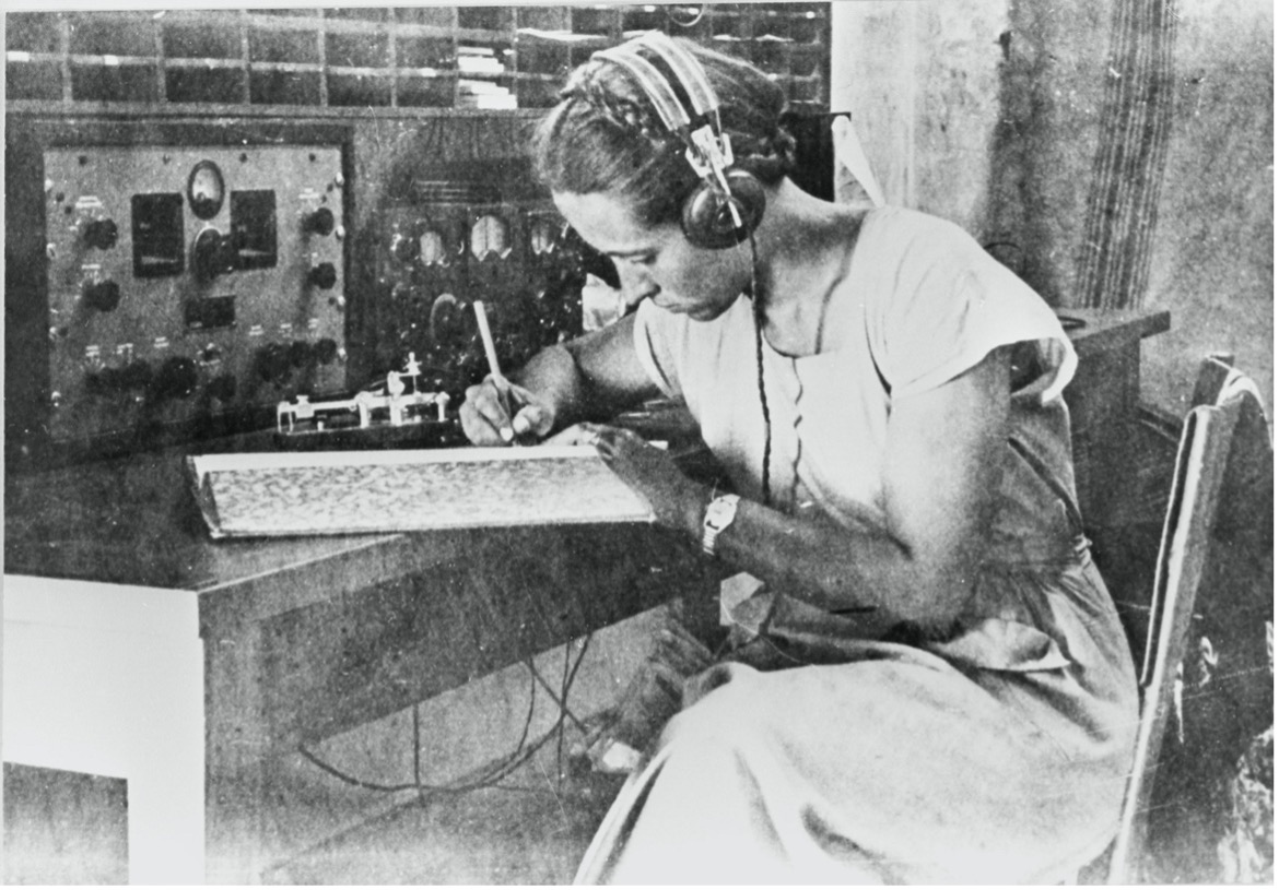 A Female Morse operator receiving a transmission