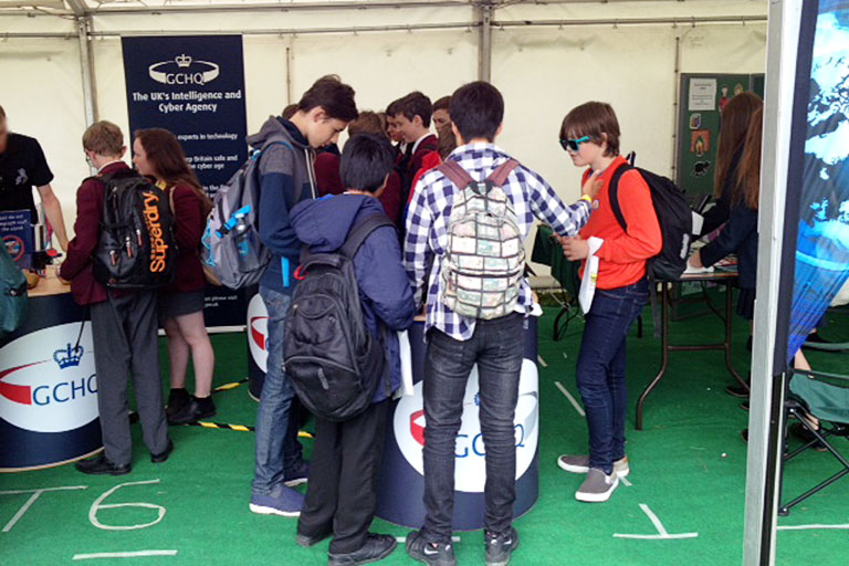 Schoolkids gathered around one of the stands