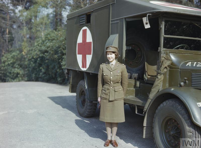 Princess Elizabeth stood in front of an ATS ambulance