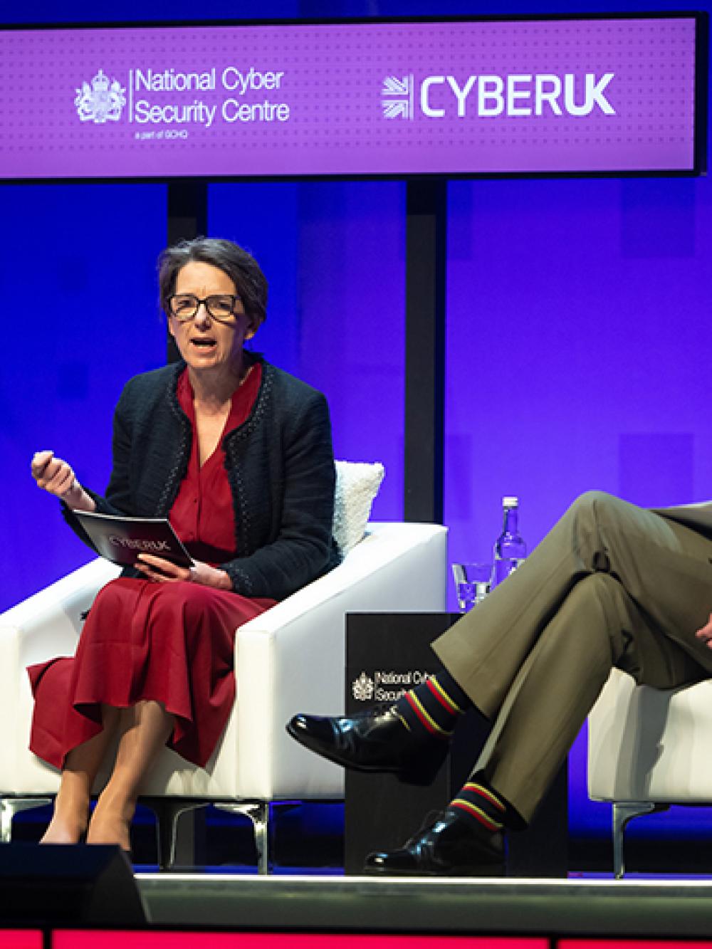 Image of Director GCHQ Anne Keast-Butler on the CYBERUK stage alongside Gen Sir Rob Magowan.