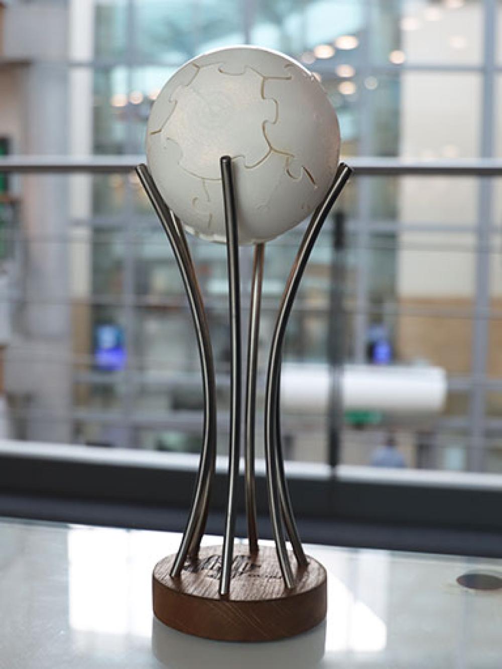 An image of the NLC Trophy on a desk