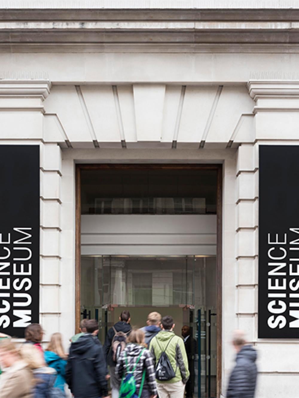 London Science Museum entrance with a queue of people entering
