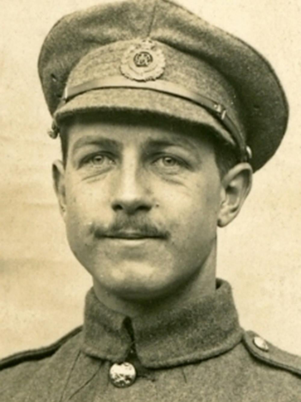Man with moustache, in WWI army uniform and hat