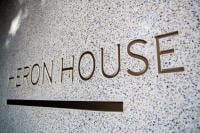 The external of the building reads 'HERON HOUSE'