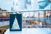 2022 Christmas card on a desk overlooking the Benhall street
