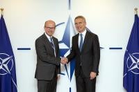 Director GCHQ Jeremy Fleming and NATO General Secretary Jens Stoltenberg shaking hands