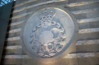 The GCHQ Badge carved into a wall inside GCHQ's headquarters in Cheltenham