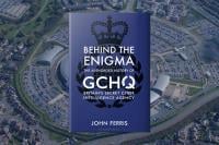 Behind The Enigma front cover superimposed on an aerial image of the GCHQ headquarters