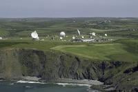 A general view photograph of our site at Bude. On hills sit satellite dishes and radomes.