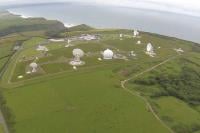GCHQ's Bude site as seen from the sky, featuring numerous antennas on the coast
