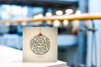 An image of the GCHQ Christmas Card on the edge of a desk
