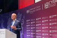 Director GCHQ, Sir Jeremy Fleming delivering a speech on stage at CyberUK.