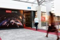 An image of the exterior of GCHQ's Event Management Centre while blurred staff walk past