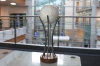 An image of the NLC Trophy on a desk