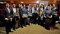 Winners of the Rare Rising Stars awards pose with their awards.