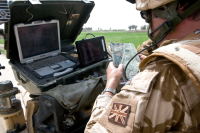 A British soldier operating communications technology