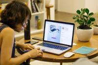 Woman working on her laptop from home