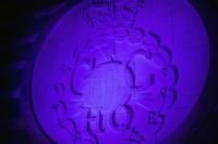 The GCHQ badge lit up in purple