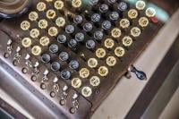 The teleprinter has lots of numbered buttons in a confusing non-standard formation and number order.
