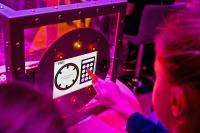 Students answering question on The Vault game which GCHQ took to the Science Festival
