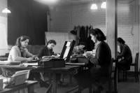 An image from Bletchley Park of three female codebreakers at work